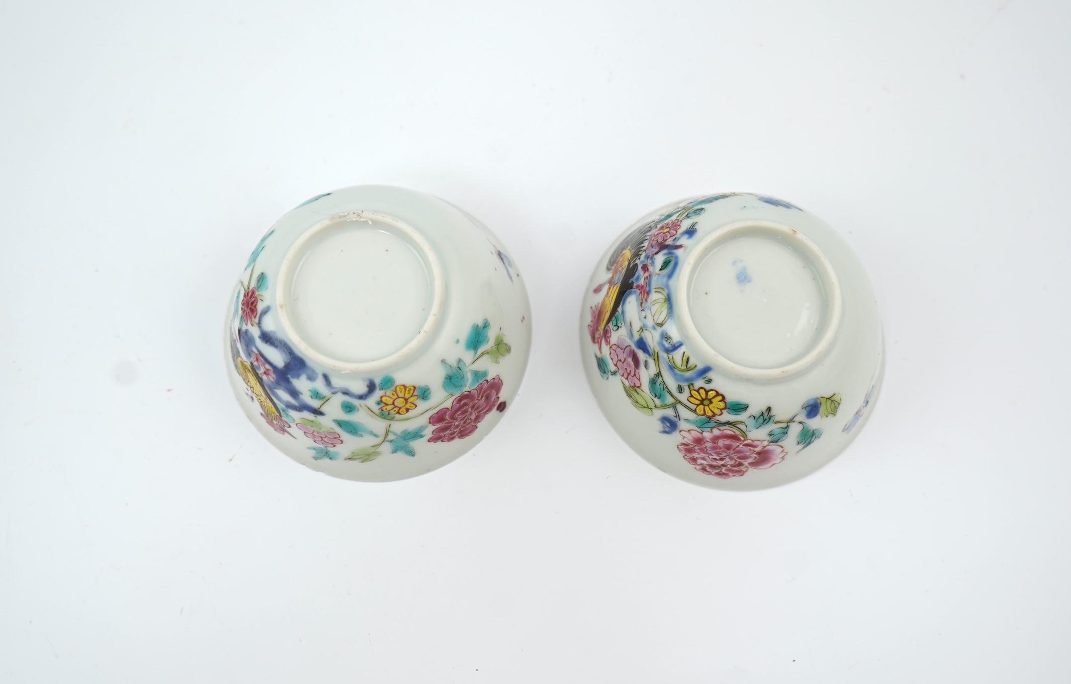 A near pair of Chinese famille rose ‘cockerel’ tea bowls and saucers, Yongzheng period